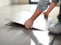 installing floor tiles